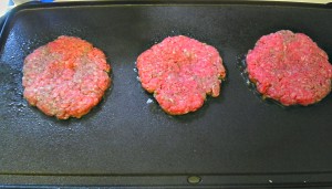 Raw Burgers on Griddle